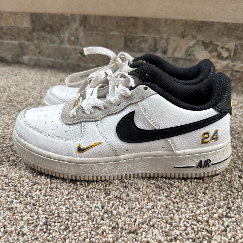 Nike Air Force 1 White Sneakers with Black and Gold Accents